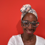 Kristen Greene, a Black woman wearing glasses and a head scarf